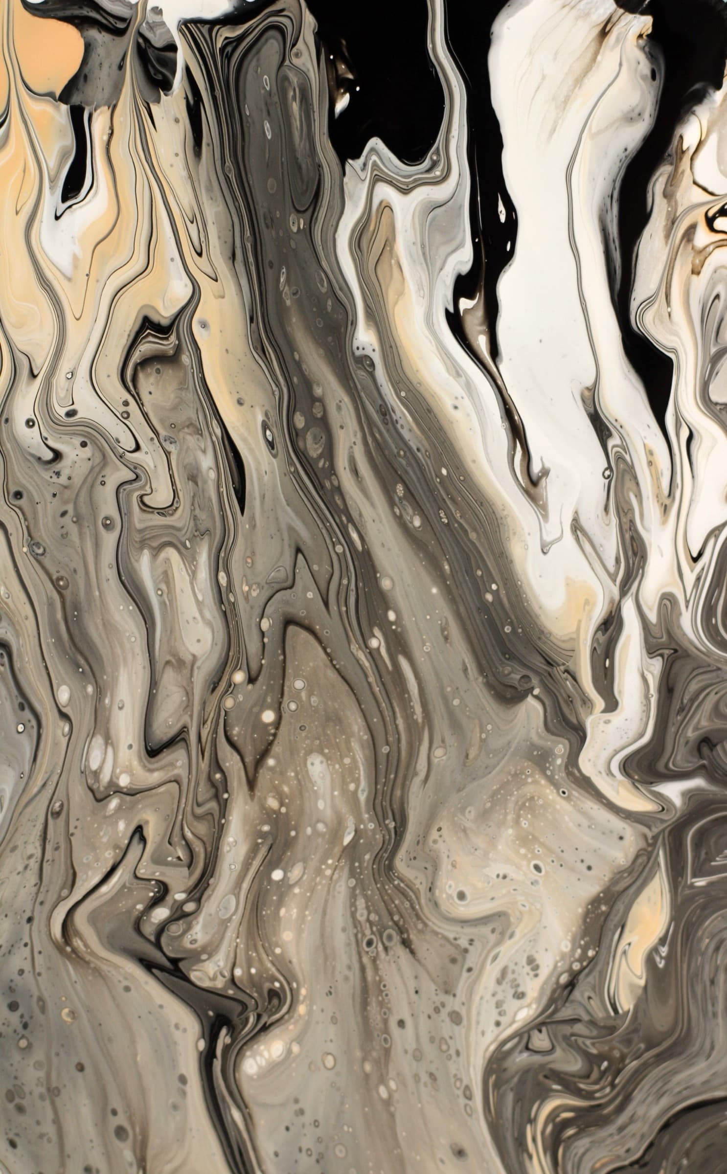 Close detail of natural stone slab, warm gold and charcoal veining
