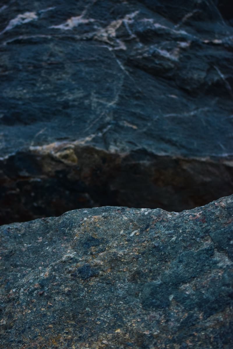 Close detail of rugged dark granite rock texture