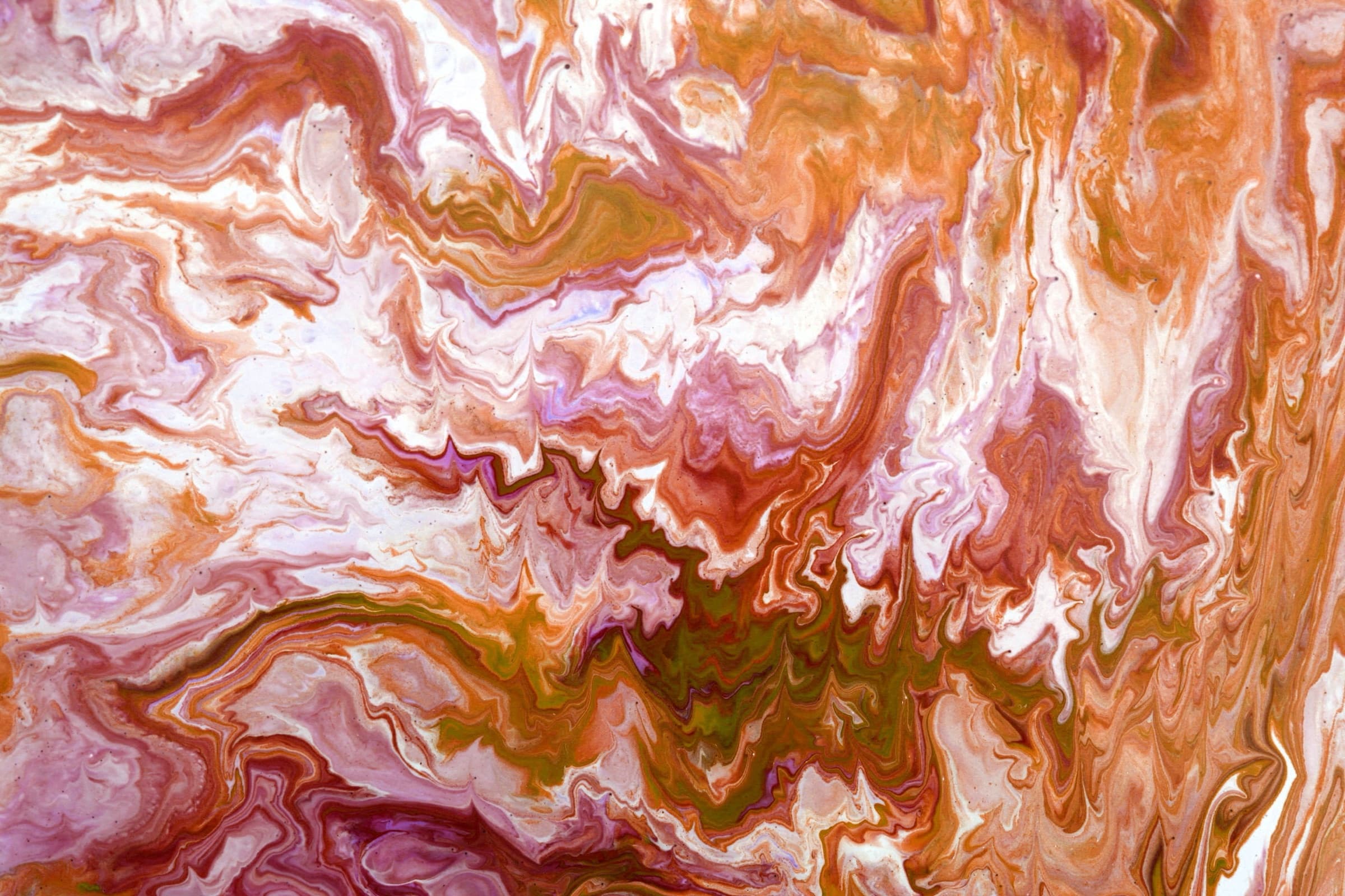 Warm abstract natural stone veining in coral, amber and cream tones